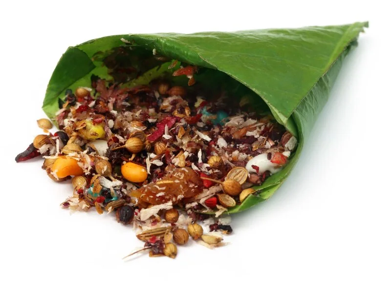 Paan mukhwas spilling from a betel leaf cone